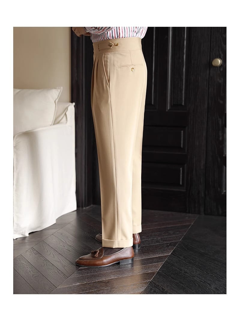 Men’s khaki tailored pleated wool straight leg trousers with a pleated front and gold toned buttons.