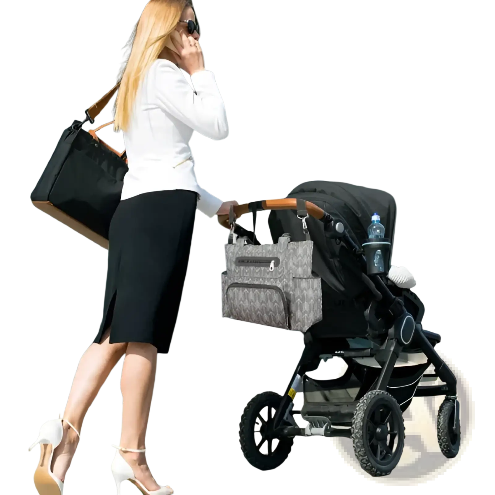 Gray patterned diaper bag with arrow print attached to stroller handle in 8 piece multifunctional diaper bag set