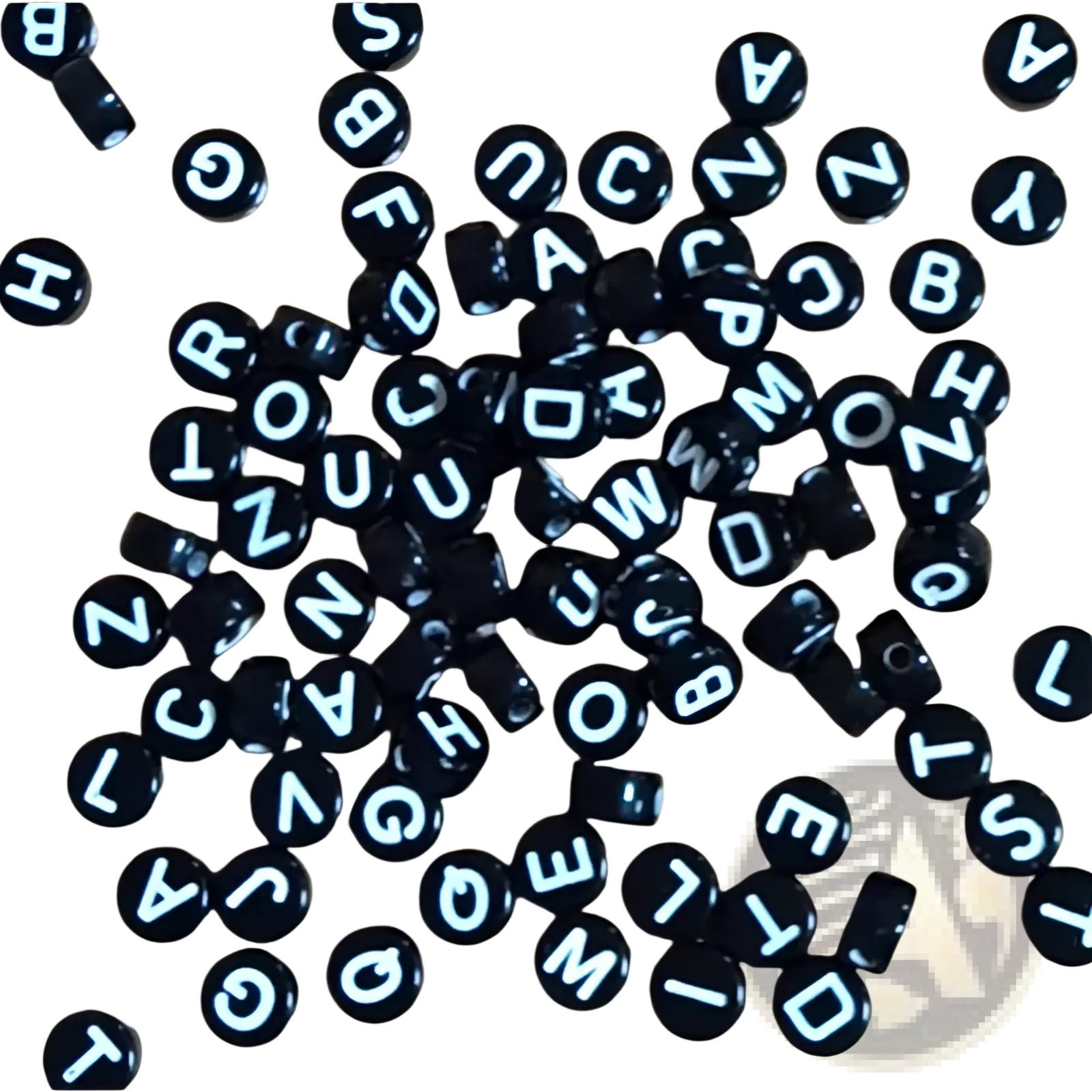 Black circular glossy acrylic alphabet beads with white uppercase letters from the 800 piece bead set