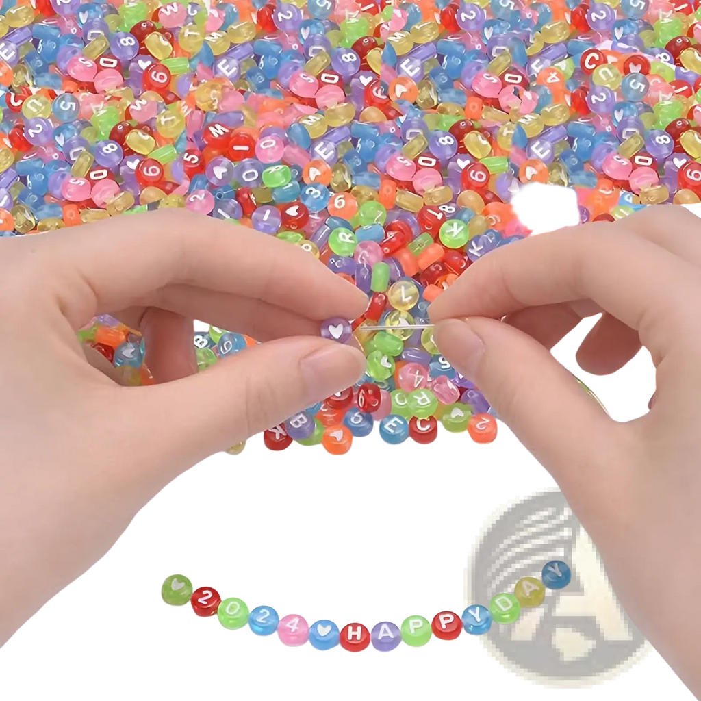 A pair of hands threading colorful translucent acrylic alphabet and number beads from an 800 piece mixed set