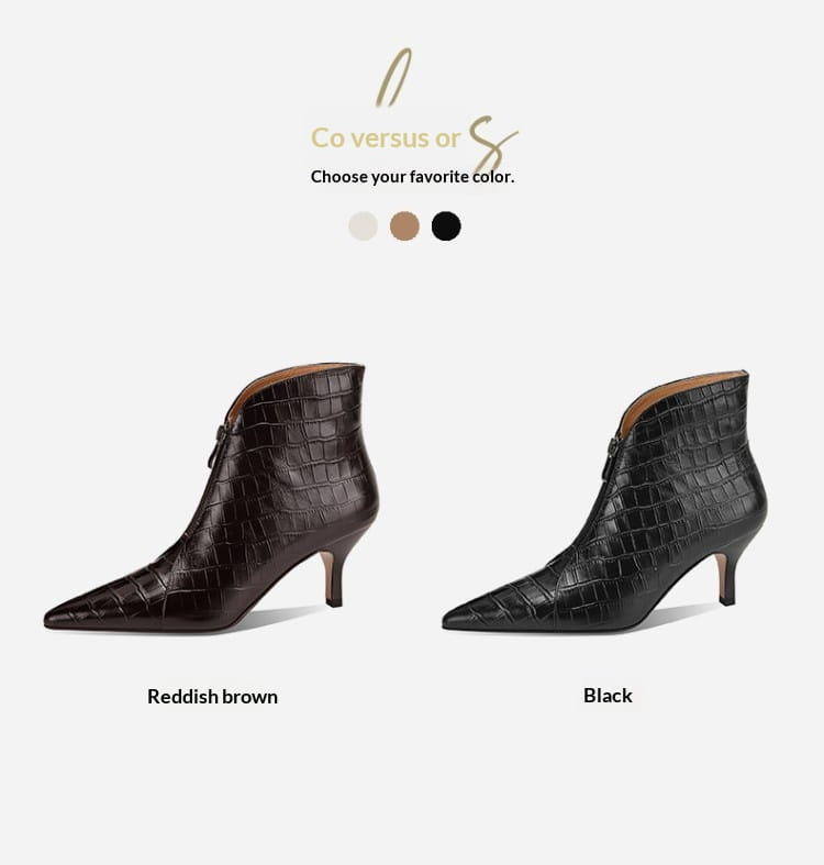 Reddish brown and black croc embossed leather stiletto ankle boots with a pointed toe and slender heel.