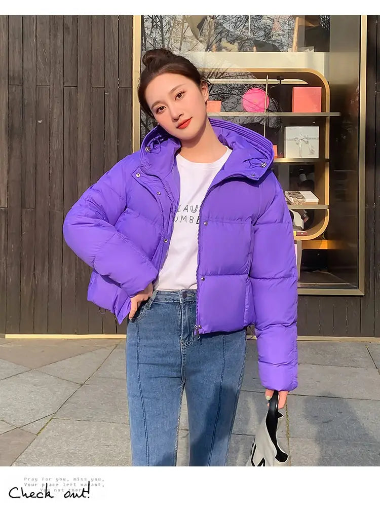 Vibrant purple women hooded short down jacket featuring a quilted design and a warm hood for cold weather.