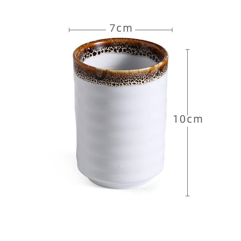 a white ceramic Japanese mug with a textured brown speckled rim measuring 7cm in diameter and 10cm tall designed as a retro hand-painted tea cup with a 250ml capacity