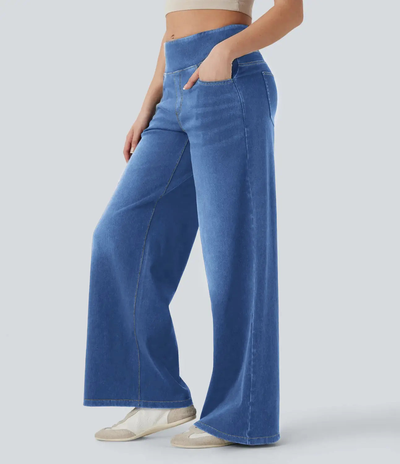 Blue wide-leg stretchy high waisted denim jeans with subtle fading and a comfortable fit.