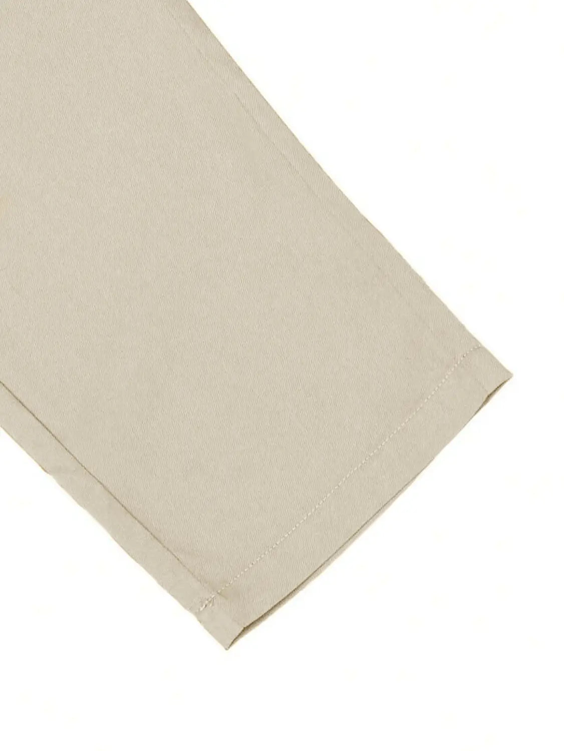 Beige cotton slim fit tapered jogger pants with drawstring and neatly stitched hem.