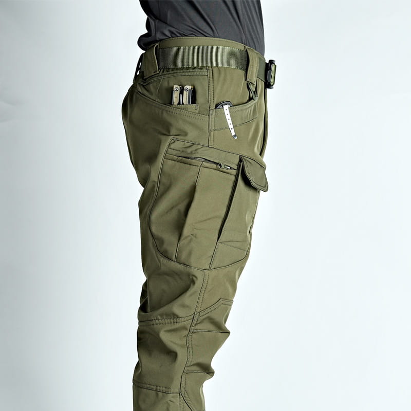Men’s olive green fleece-lined waterproof tactical cargo pants with multiple pockets and durable fabric.