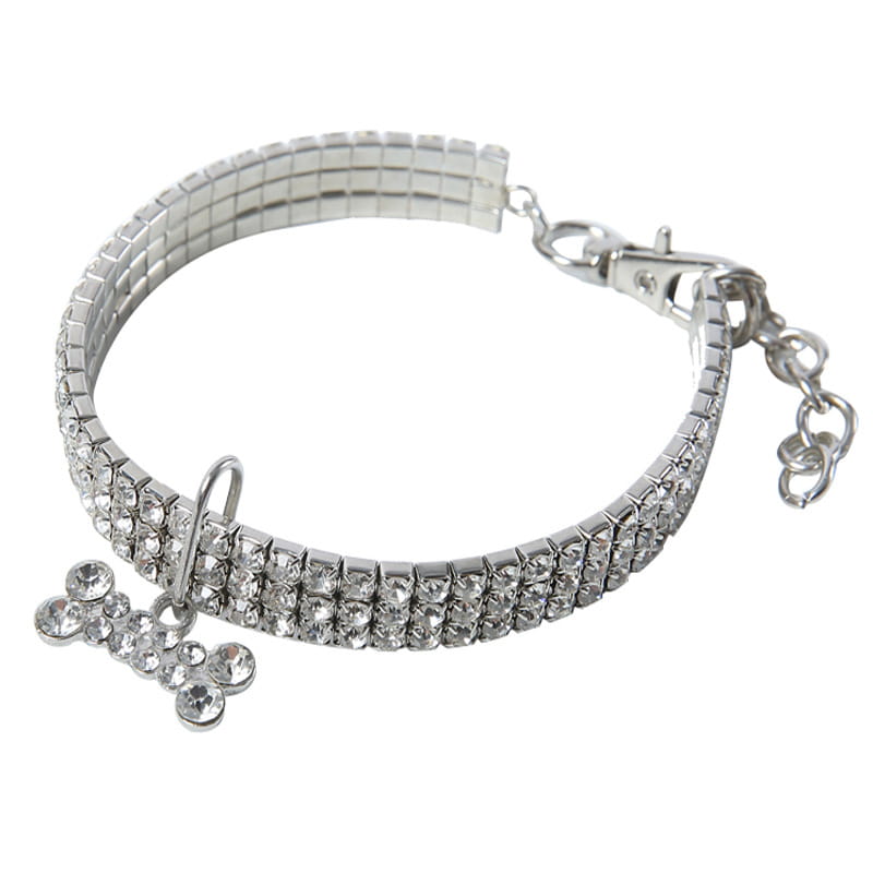 Silver rhinestone dog collar featuring a crystal bone charm designed for stylish pet accessories.