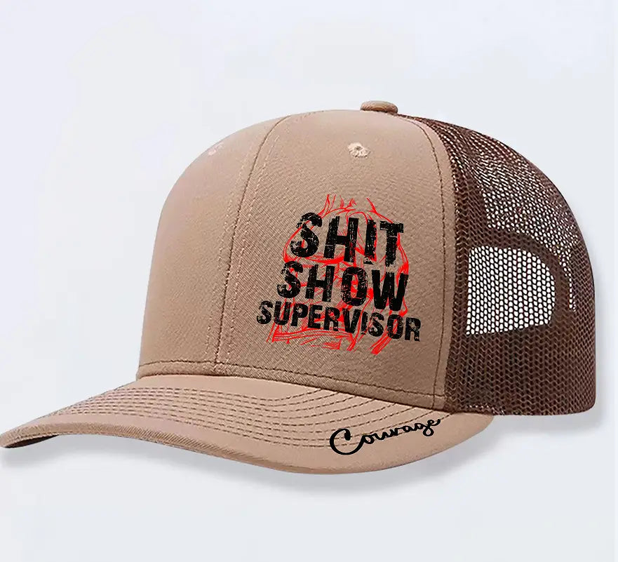 Tan and brown trucker hat for men featuring shit show supervisor printed in black over a red flame design with courage scripted on the brim.