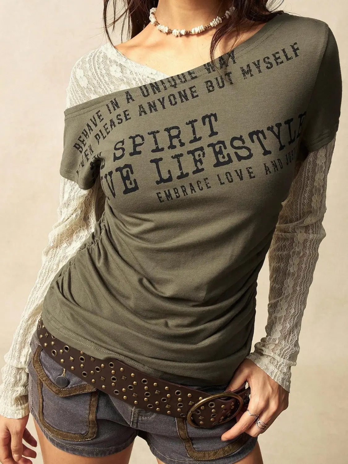 Olive green lace layer off shoulder knitted top with black printed text and sheer lace long sleeves.