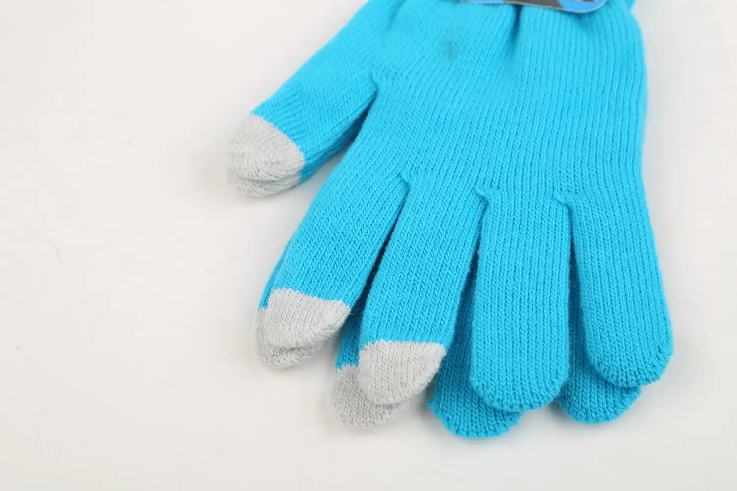 Leuchtend blaue, gestrickte Touchscreen-Winterhandschuhe mit grauen Fingerspitzen, ausgelegt für Wärme und unisex Nutzung.