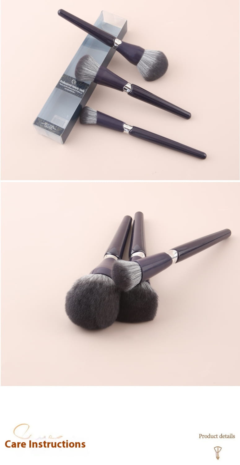 Set of three professional makeup brushes with soft hair bristles, sleek black handles, and silver accents designed for precise face powder application.
