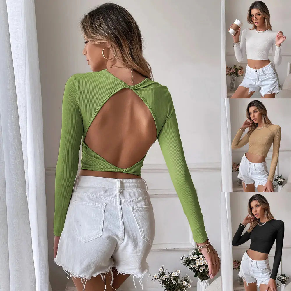 green ribbed slim fit long sleeve crop top showing back cutout design