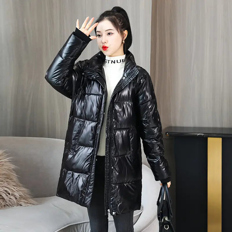 Glossy black plus size puffer jacket made of quilted material with a high collar and front zipper.