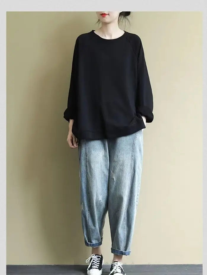 women’s relaxed oversized cotton blend pullover sweatshirt in black with long sleeves, relaxed fit, and rolled cuffs