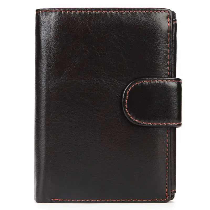 Monedero bifold de cuero vintage negro con piel de vacuno fina, costuras rojizas marrón a contraste y cierre de solapa a juego.