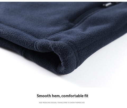 dark navy fleece pants with a soft plush texture and neatly finished hem paired with mens fleece casual multipocket winter jacket.