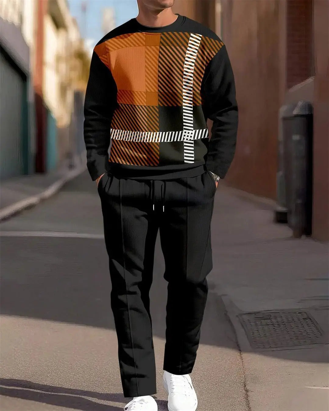 Ensemble sweat à carreaux et pantalon pour hommes, comprenant un sweat-shirt noir avec un motif à carreaux orange vif et marron, ainsi que des rayures diagonales blanches sur la poitrine.