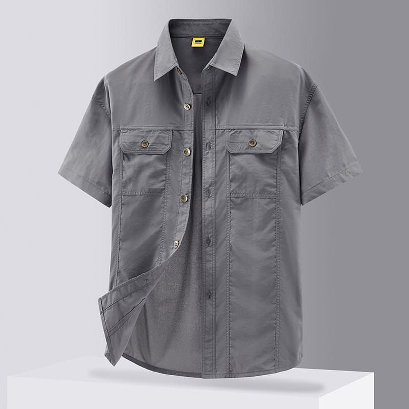 Men solid workwear shirt short sleeve in gray with two chest pockets and brass buttons.