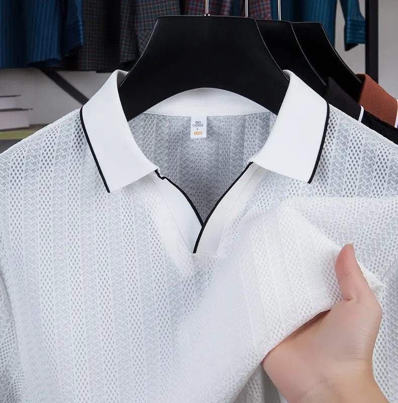 White mesh men’s textured ice silk polo shirt with black contrast trim on the collar and placket.