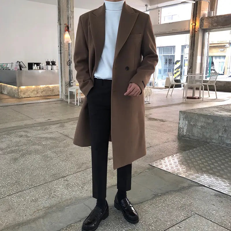 A sleek long brown wool overcoat with a classic double-breasted design and notched lapels suitable for winter wear.