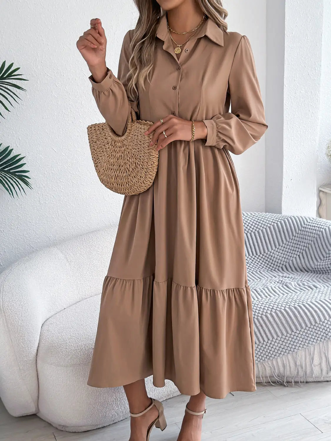 Beige women’s long sleeve tiered button-down midi dress with collar made from lightweight fabric for casual and formal wear.