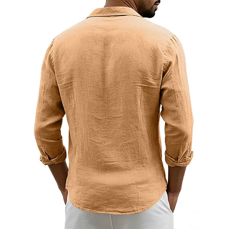 A tan slim fit men’s long sleeve casual shirt made from a linen blend with rolled-up cuffs and a classic collar.