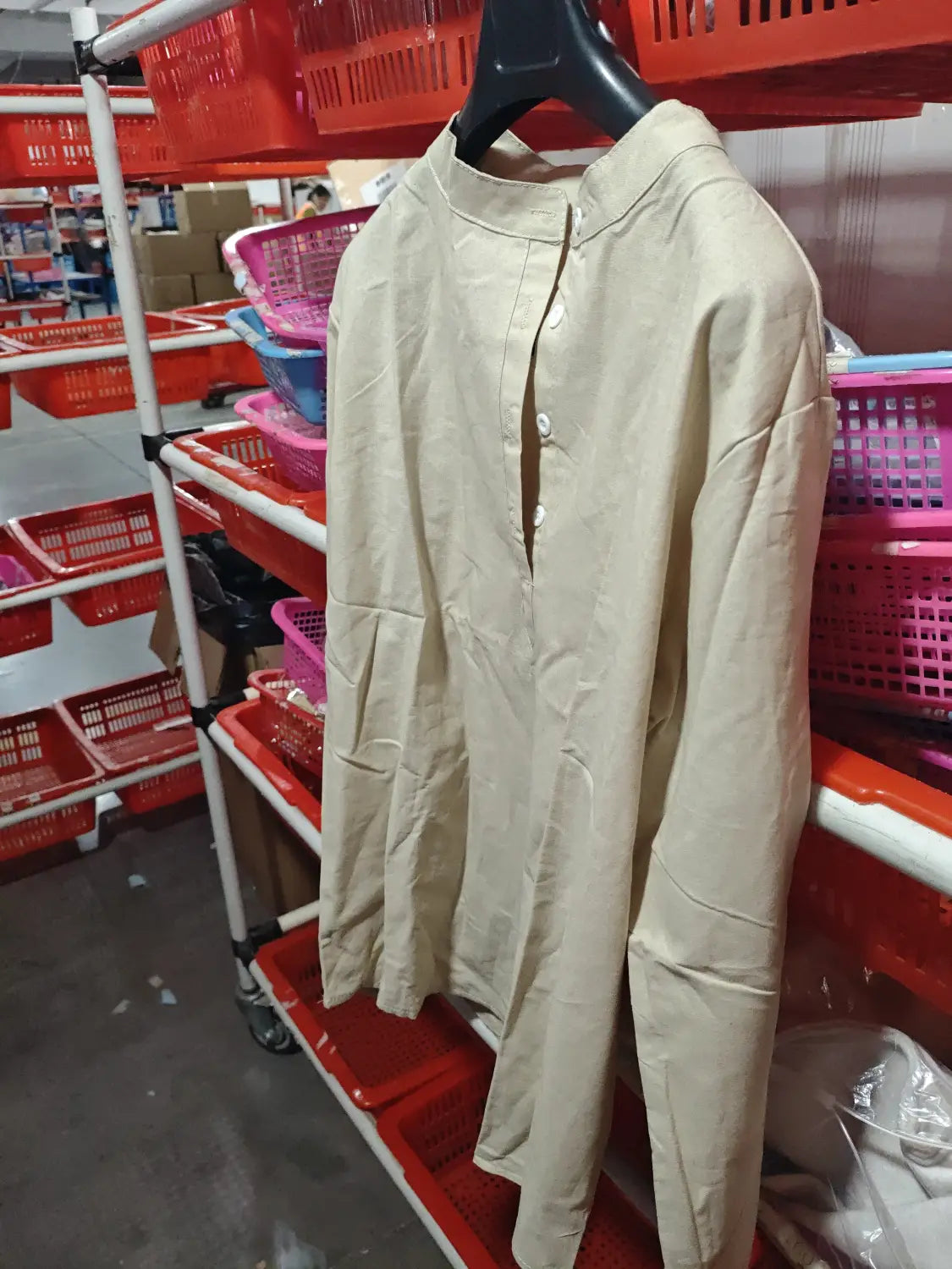 Beige loose linen blend breathable long sleeve sports shirt with a stand-up collar and button-front closure.