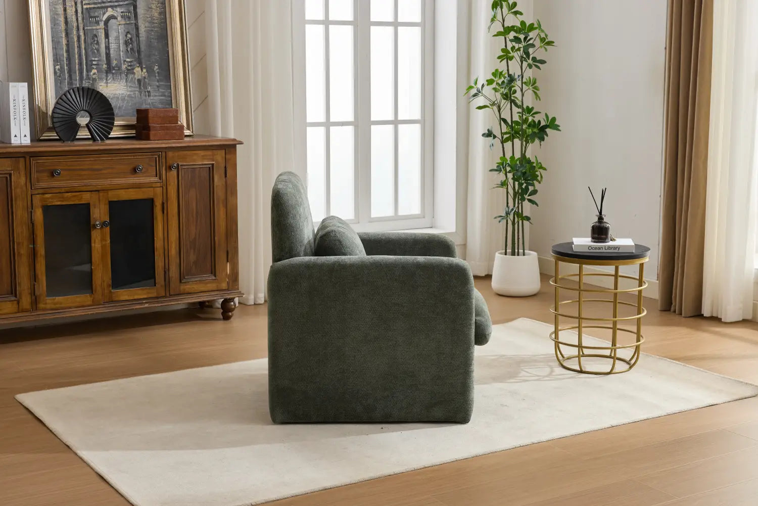 Dark green velvet boucle fabric accent chair with plush rounded cushions and modern minimalist upholstered design.