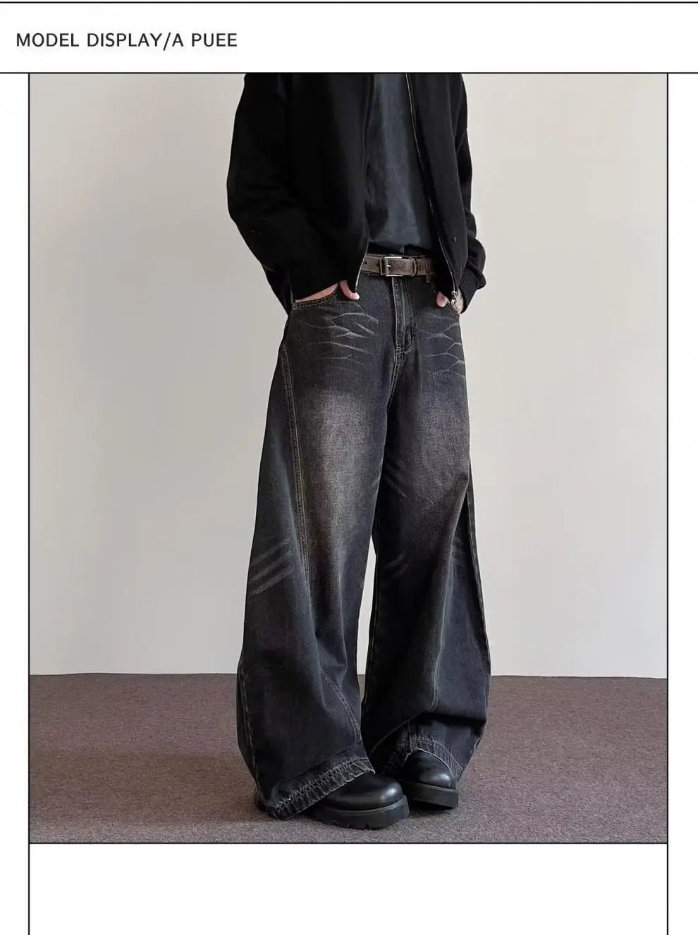 Men’s premium relaxed wide leg denim jeans in dark wash with faded distressing and frayed hems made from durable denim material.
