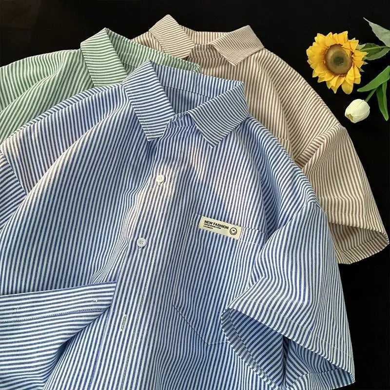 plus size striped casual shirt featuring blue and white vertical stripes short sleeves a collar and a small rectangular new fashion label on the chest pocket.