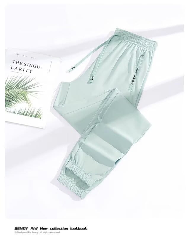 Light green slim-fit anti-mosquito casual athletic trousers with elastic cuffs and side pockets designed for comfort and protection.