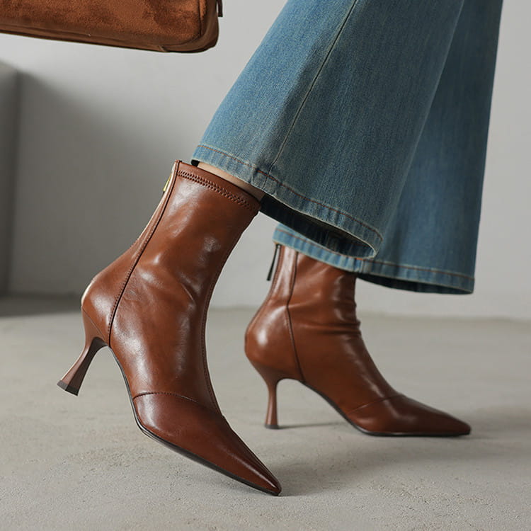 brown leather ankle boots with pointed toe and slim high heel made of cowhide featuring a zipper closure