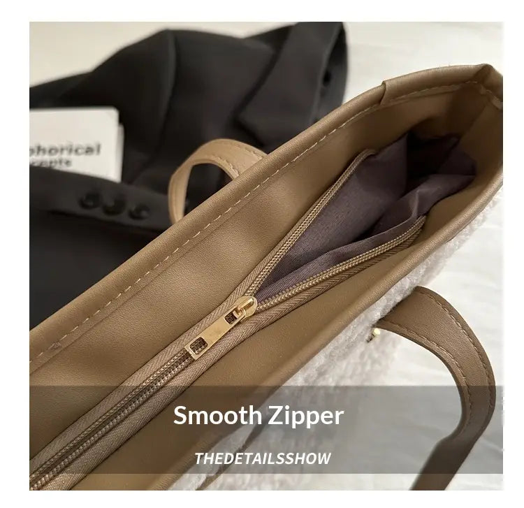 brown faux fur tote bag with tan faux leather handles and gold-toned zipper closure