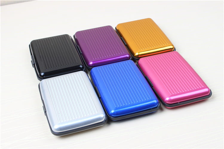 Set of six colorful metallic rfid blocking aluminum alloy ribbed card holder cases in black, purple, gold, silver, blue, and pink.