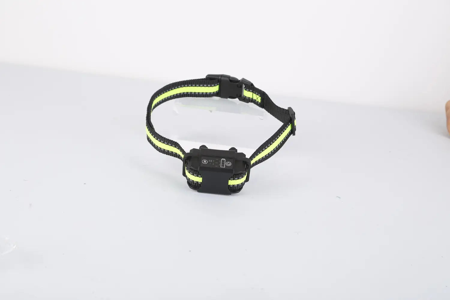 Black and neon yellow reflective smart dog bark collar with a compact rechargeable electronic control unit and dual training modes.