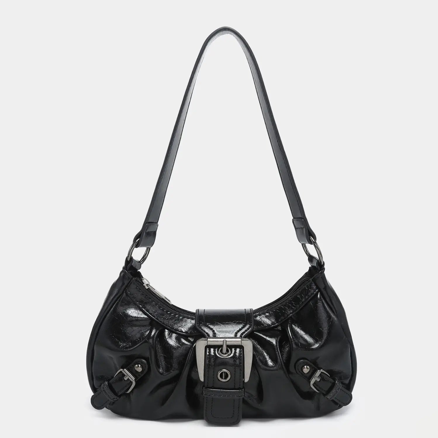Black patent leather hobo bag with silver-toned buckle and strap hardware featured in a vintage leather shoulder bag with buckle details.