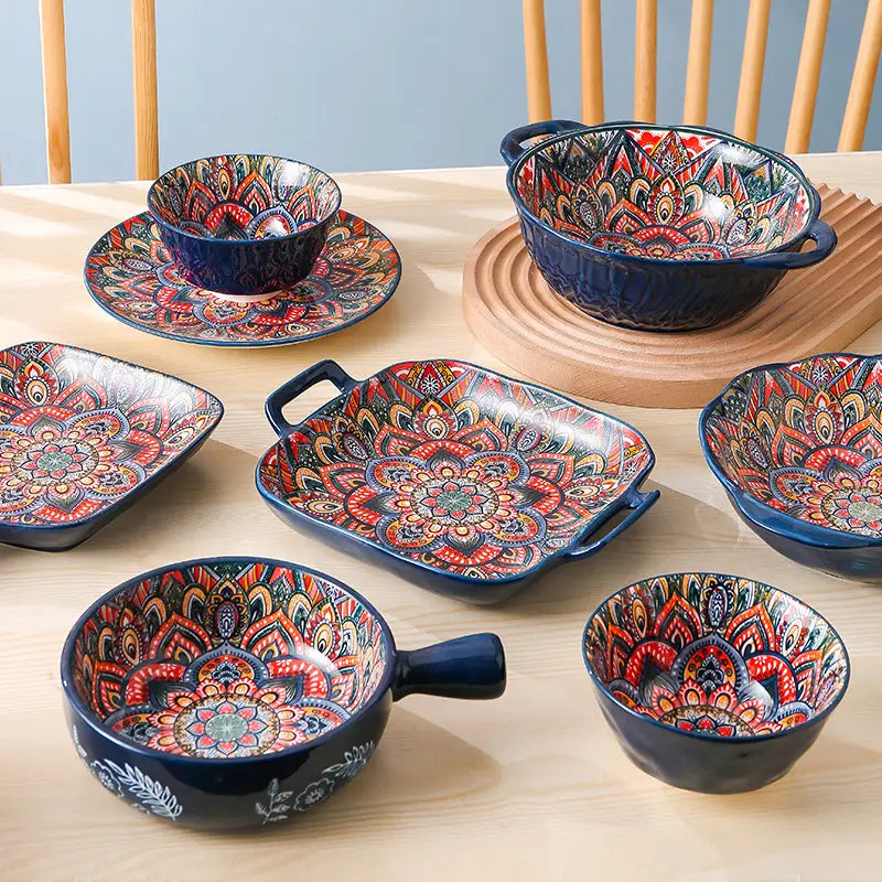 Ceramic mandala serving bowls and dishes hand painted with intricate red orange and gold patterns on a deep blue glaze with a 400ml capacity
