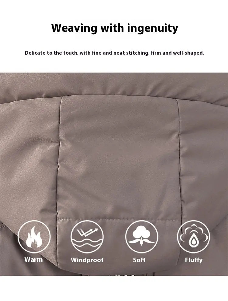 Veste courte matelassée à capuche grise pour femme, avec finitions soignées et isolation moelleuse, conçue comme un manteau d’hiver chaud.