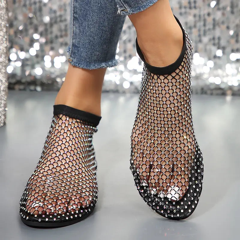 Rhinestone mesh flat ankle boots for women in black featuring sparkling silver rhinestones along the edges and sole.