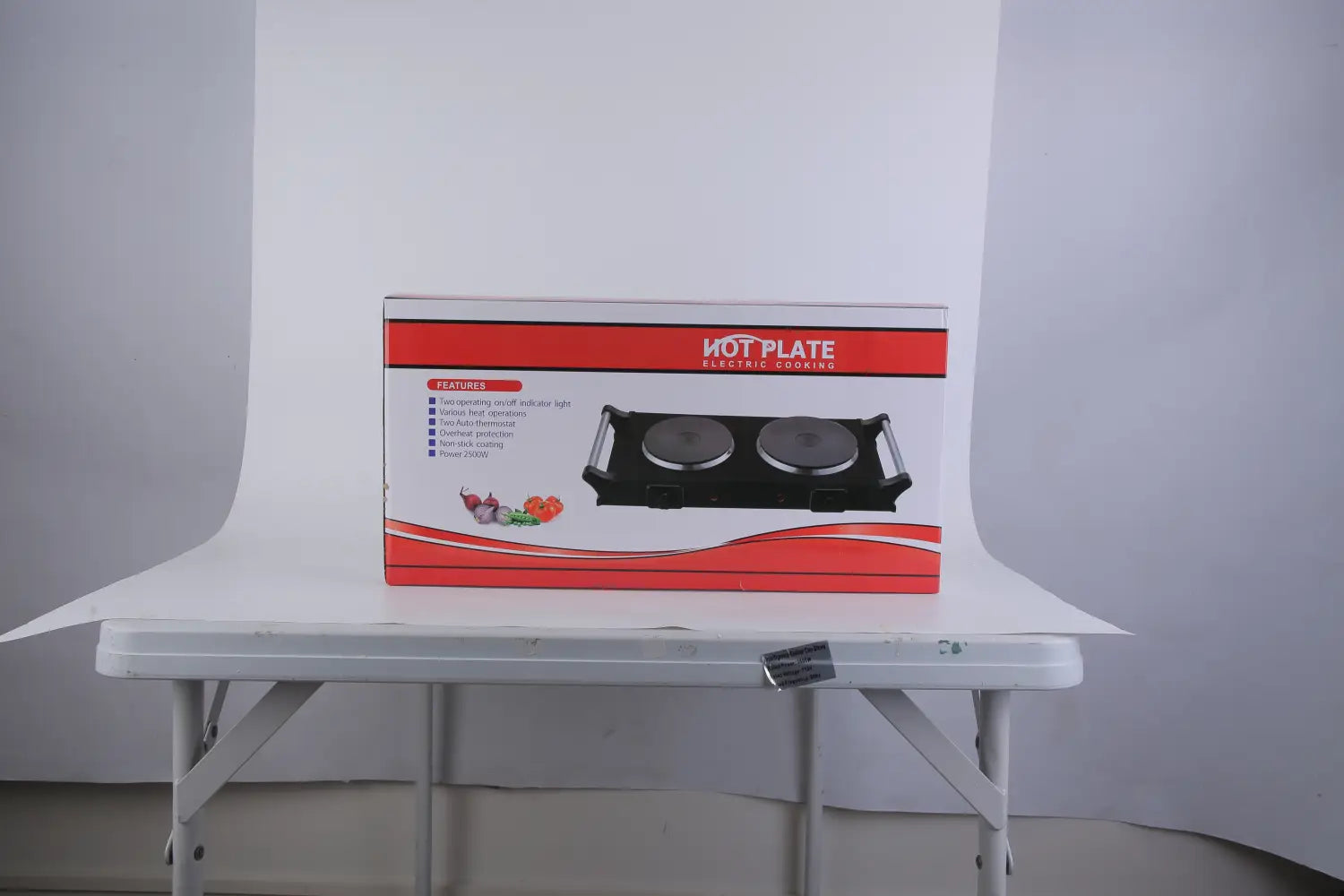 Red and white box packaging for a black 1800w electric double burner portable infrared hot plate with two circular cooking surfaces.