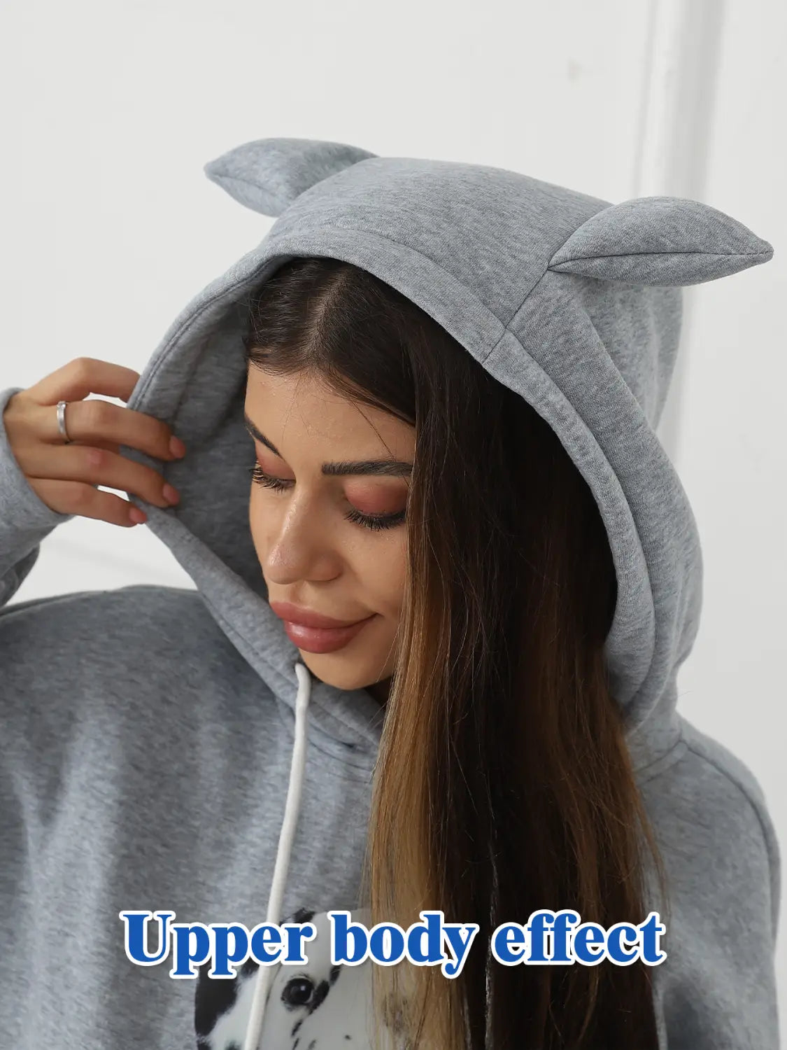 Women’s Dalmatian print hoodie in gray with soft plush cat ears on the hood and white drawstrings made from comfortable fabric.
