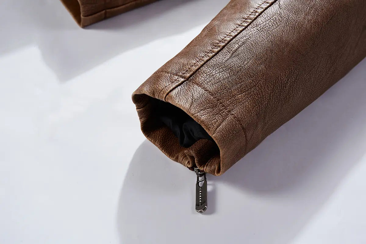 brown faux leather moto jacket sleeve with ribbed detail and silver zipper pull