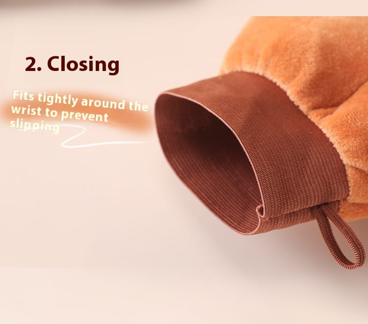 Warm plush orange tanning mitt and exfoliating bath glove with a snug brown elastic wristband and matching drawstring for a secure fit.