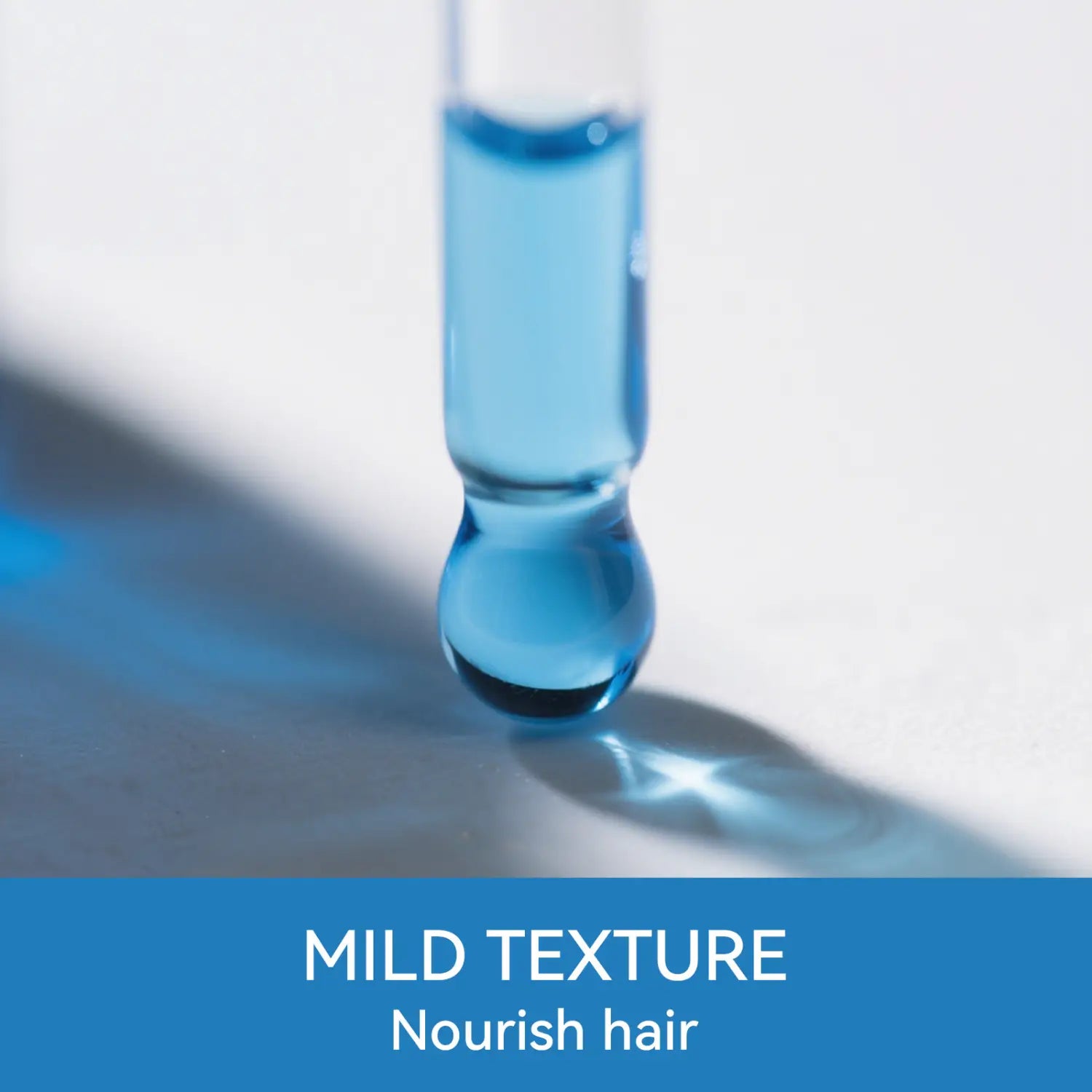 A clear glass dropper filled with vibrant blue liquid poised to dispense blue copper peptide hair growth serum 30ml for nourishing and promoting hair growth.