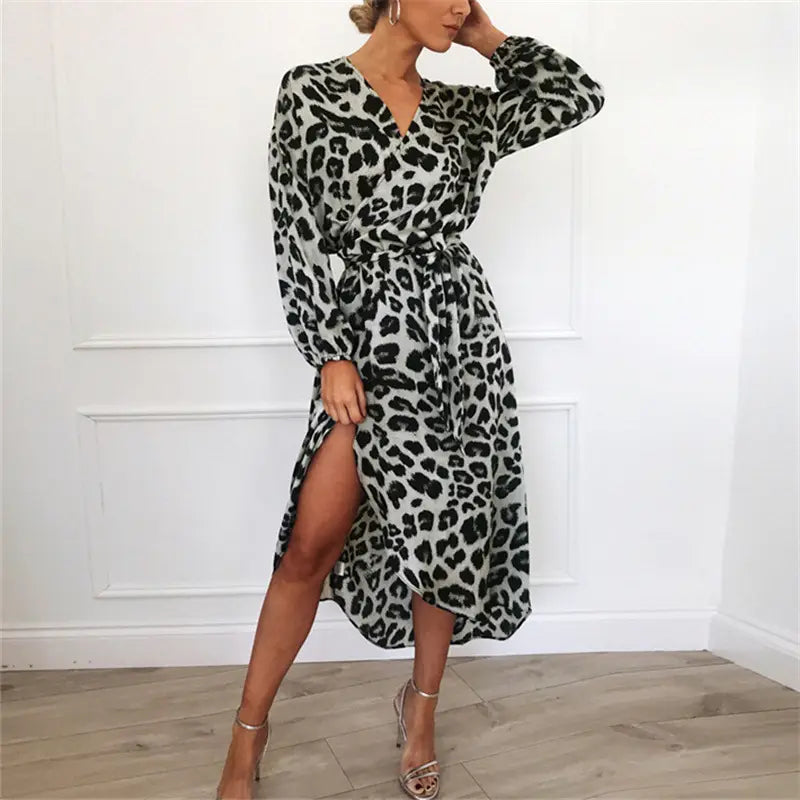 A stylish black and gray leopard print chiffon wrap dress with long sleeves v-neckline and a high slit.