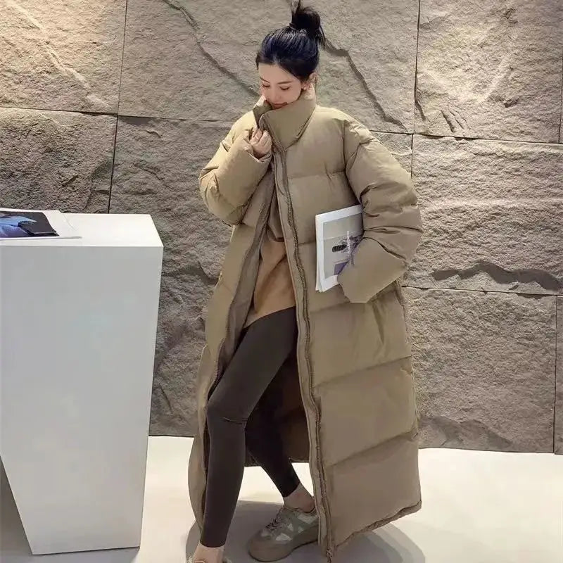 Beige women long quilted puffer coat made of cotton with a high collar designed for winter use.