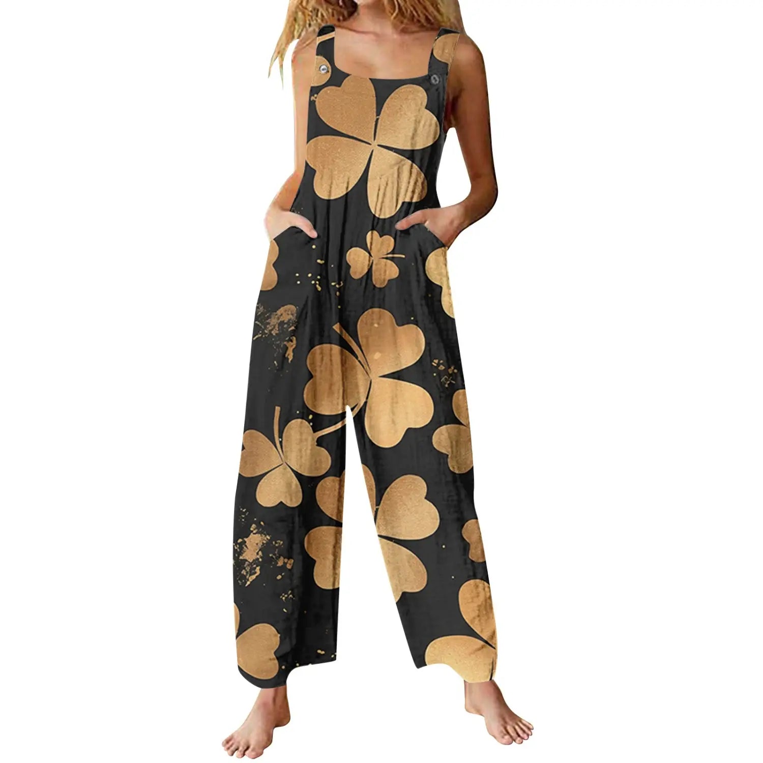 Black and gold shamrock patterned wide-leg suspender pants with button straps in casual 3d printed design.