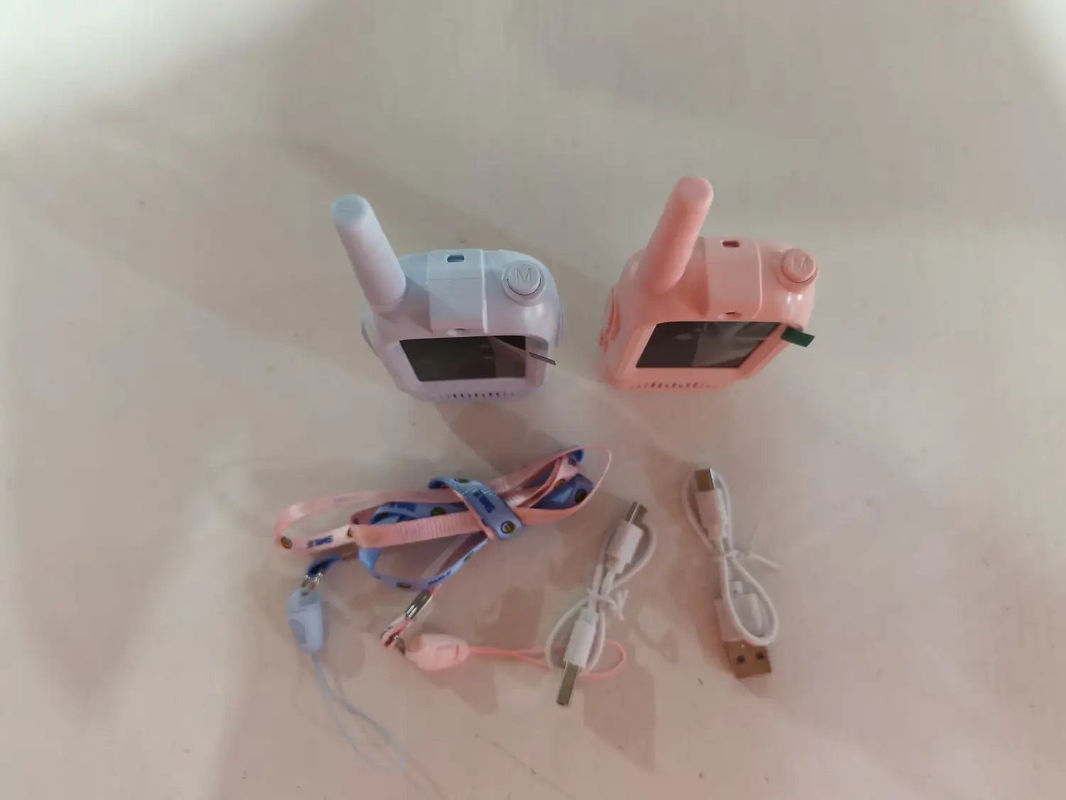 two pastel-colored kids video walkie talkies 2 pack rechargeable intercoms in light blue and pink each with a small antenna and screen