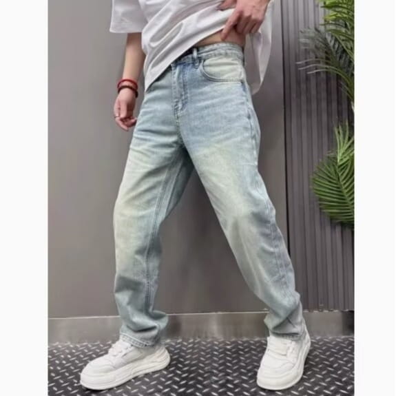 Men’s light wash relaxed straight leg denim jeans featuring a classic five-pocket design in light-wash denim.