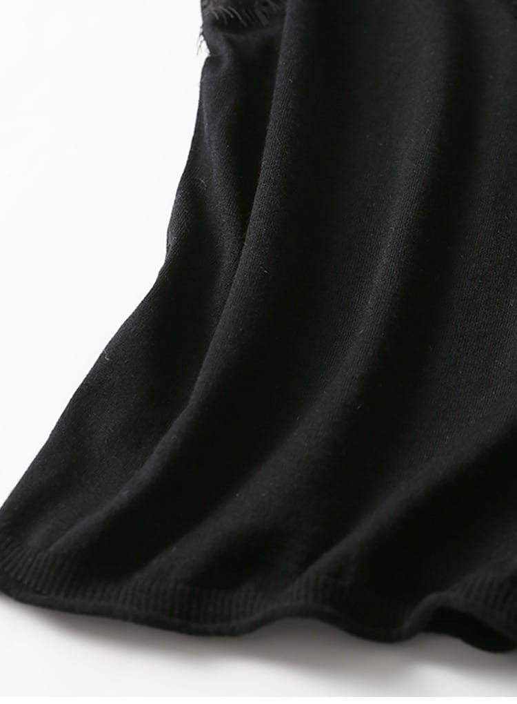 black knit fabric with a soft textured surface and ribbed hem from a lace trim camisole top